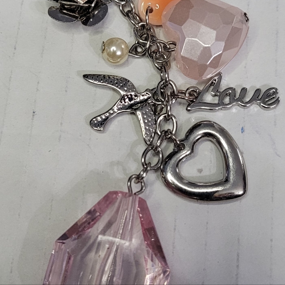Silvertone Necklace with a collage of items 32 inch chain - Picture 2 of 4